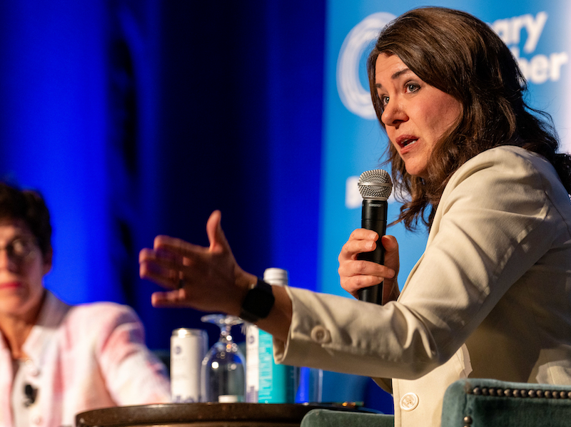 Alberta Premier Danielle Smith at the Calgary Chamber of Commerce’s armchair talk on Thursday, with Chamber President Deb Yedlin out of focus in the background.