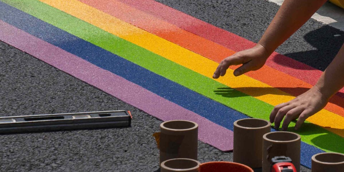 Pride art being created on the street.