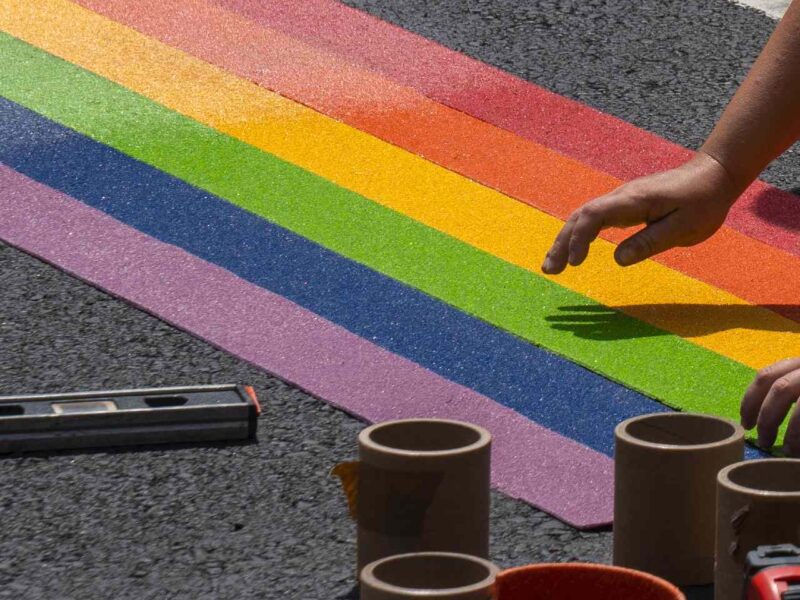 Pride art being created on the street.