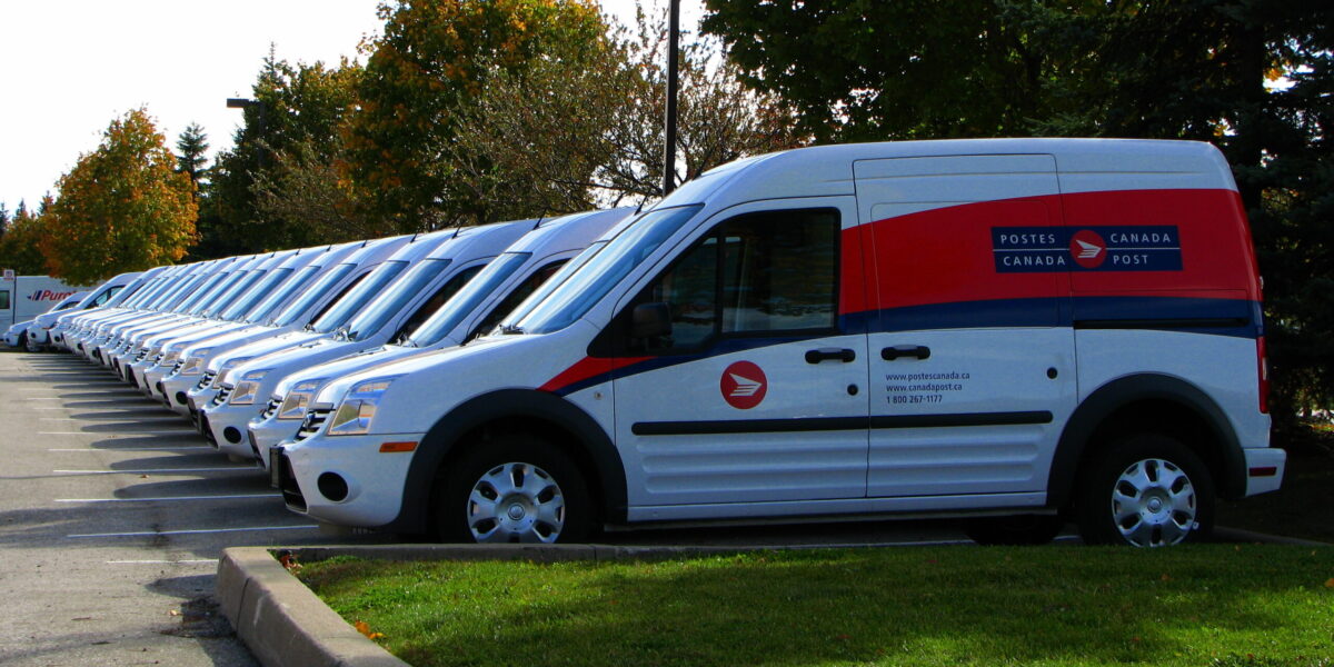 A fleet of Canada Post vans. In 2018, Canada Post workers faced back-to-work legislation during their strike.