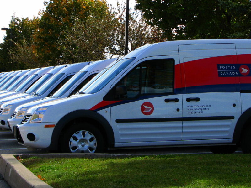 A fleet of Canada Post vans. In 2018, Canada Post workers faced back-to-work legislation during their strike.