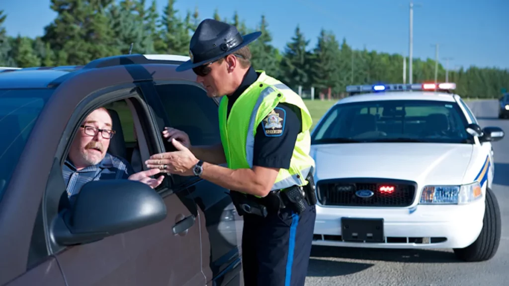 An Alberta Sheriffs Branch officer illustrates a typical traffic stop in 2008 with a volunteer driver.