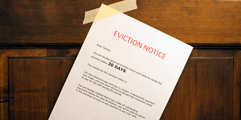 An example of an eviction notice pinned to a door.