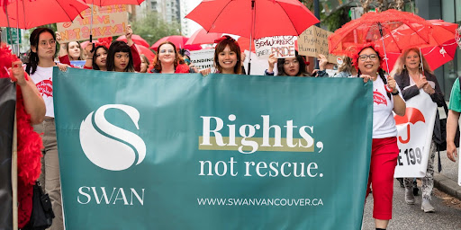 SWAN staff and volunteers at the Red Umbrella March, June 10, 2023 on Davie St. in Vancouver.