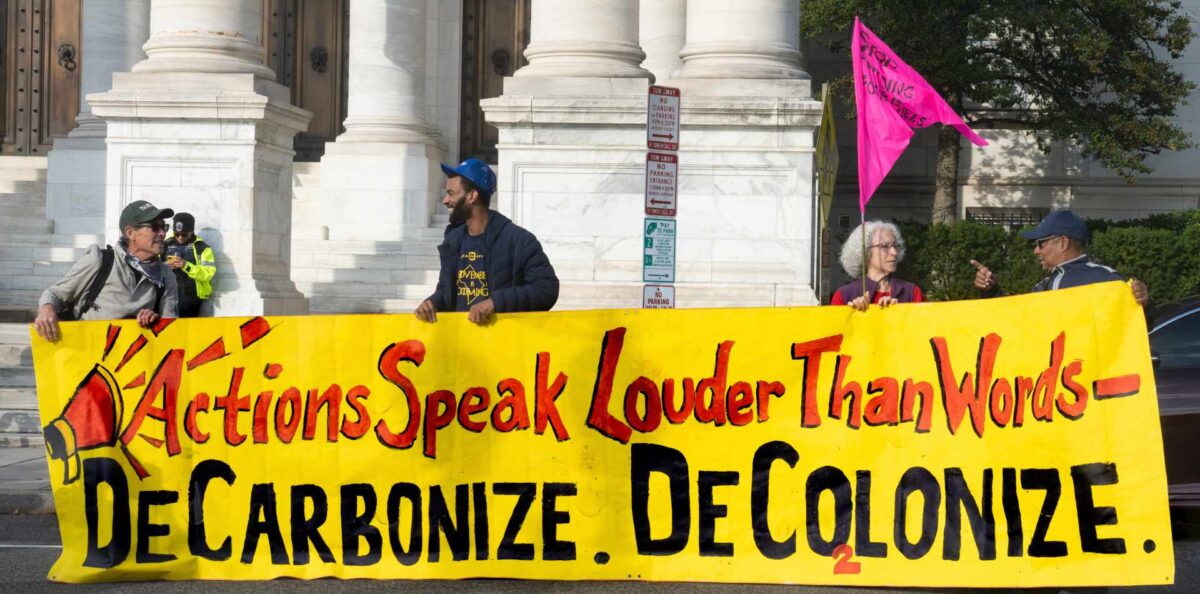 A climate action protest banner.