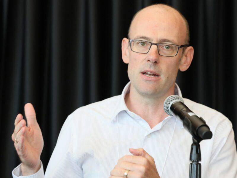 David Macdonald, senior economist with the national office of the Canadian Centre for Policy Alternatives speaks to a crowd during a panel in Medicare.