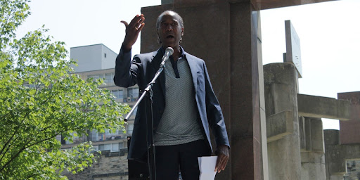 Courtney Betty, a member of the legal team for the Black Class Action Secretariat, speaks to the crowd on Thursday, August 1.