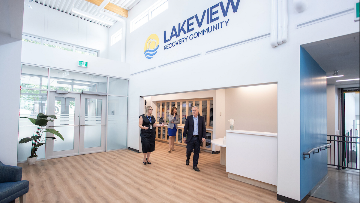 Alberta Premier Danielle Smith, centre, tours the Lakeview Recovery Community Thursday in the company of Executive Director Lyndsey Hague and her chief of staff, Marshall Smith.