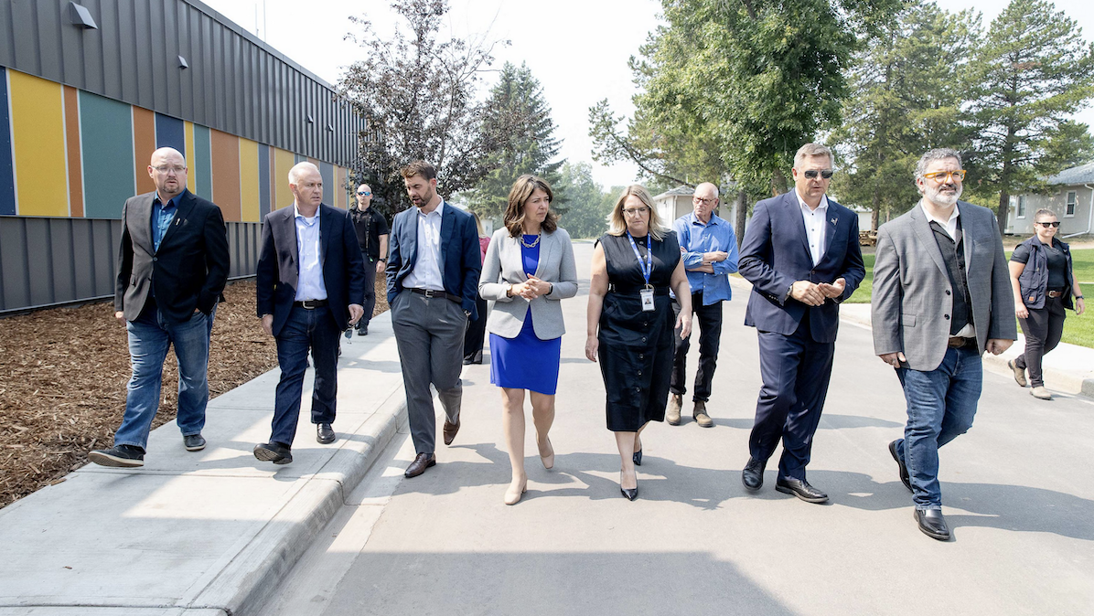 Alberta Premier Danielle Smith tours the Lakeview Recovery Community, which will be home to the Recovery Training Institute of Alberta, on Aug. 15 – her chief of staff, Marshall Smith, is second from left and RTIA Executive Director Bill Caldwell is in the foreground at right