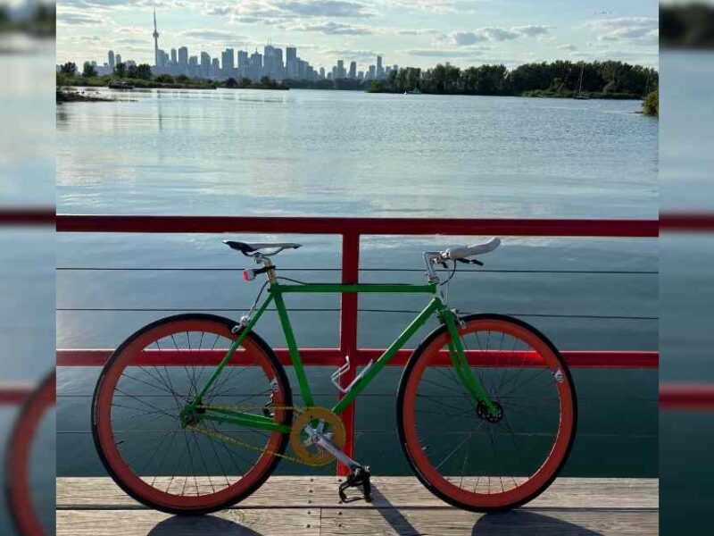 A bicycle with the Toronto skyline in the background.