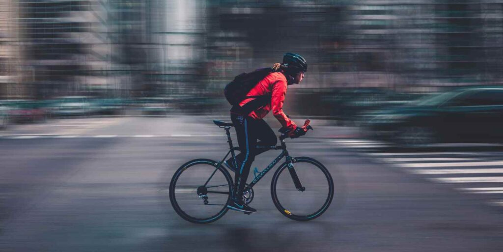 A person cycling through the city.