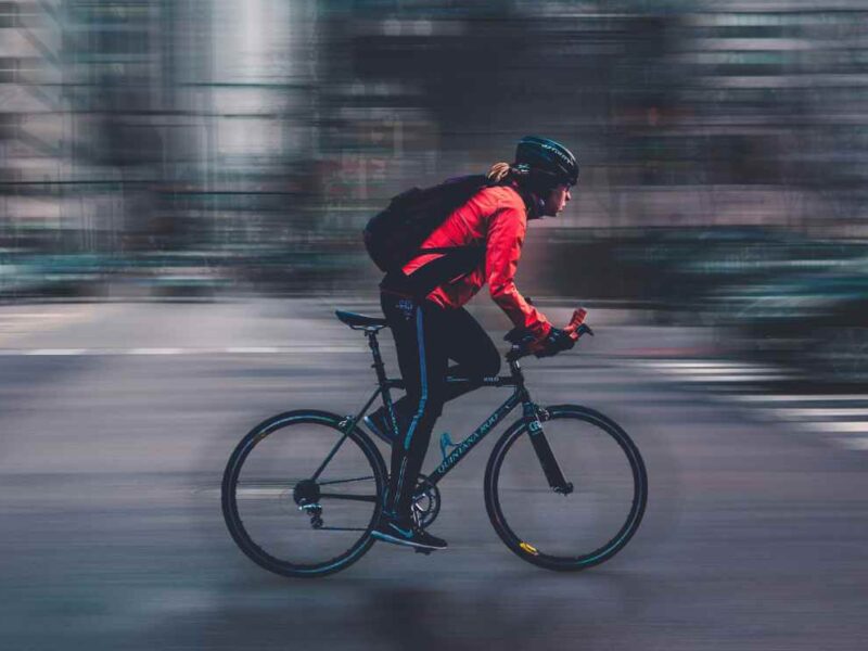 A person cycling through the city.