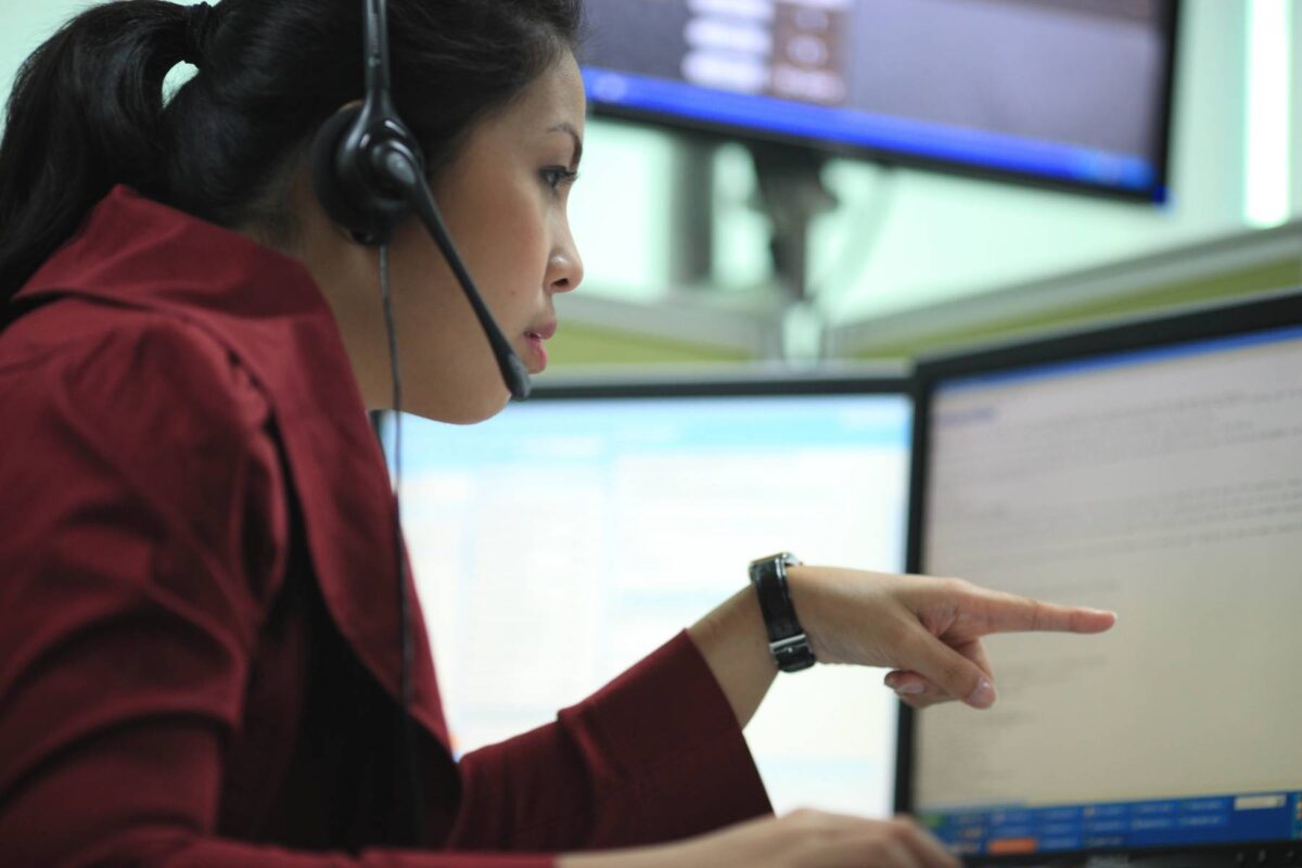 A woman working at a call centre.