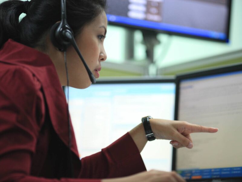 A woman working at a call centre.