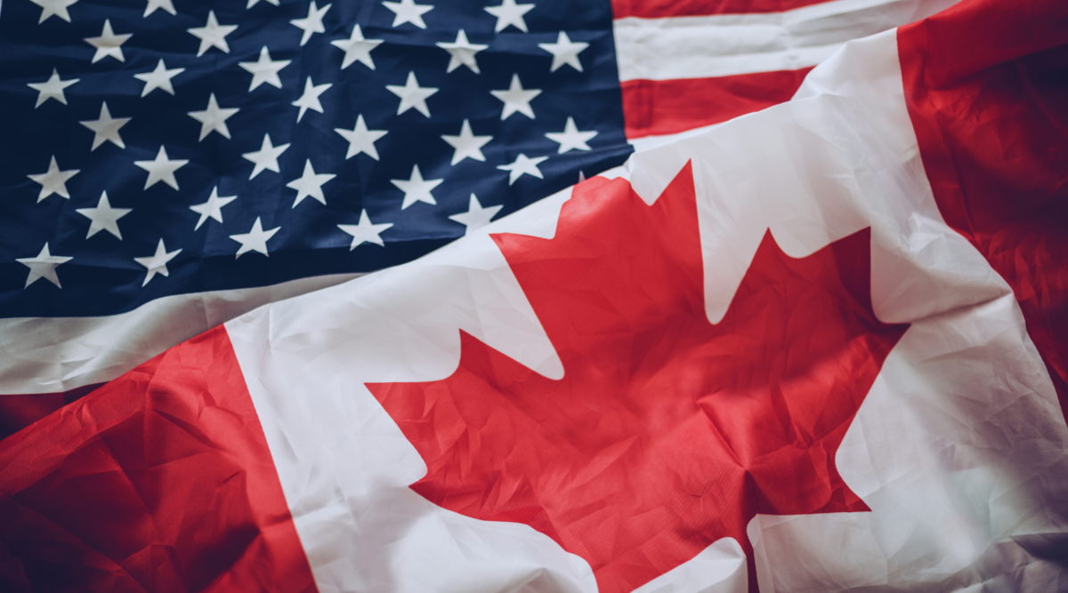 A Canadian flag and U.S. flag.