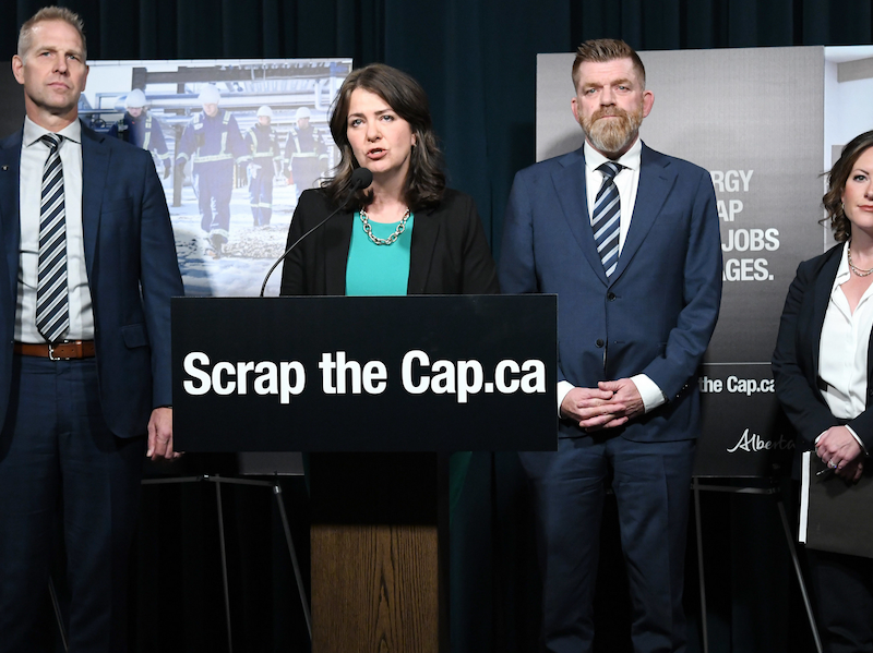 The four Horsemen of the UCP Apocalypse, from left to right, Utilities Minister Nathan Neudorf, Premier Danielle Smith, Energy Minister Brian Jean, and Environment Minister Rebecca Schulz, announce the $7-million “Scrap the Cap” campaign.