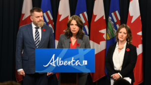 Angry Danielle Smith, flanked by Energy Minister Brian Jean and Environment Minister Rebecca Schulz.