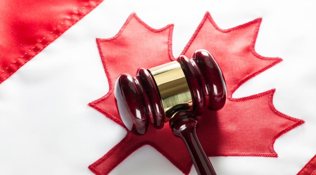 A gavel and a Canadian flag.