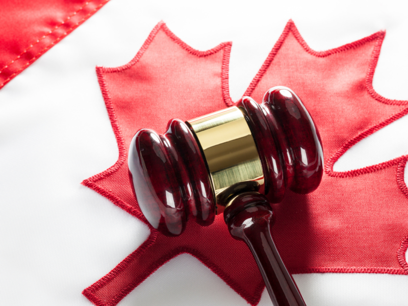 A gavel and a Canadian flag.