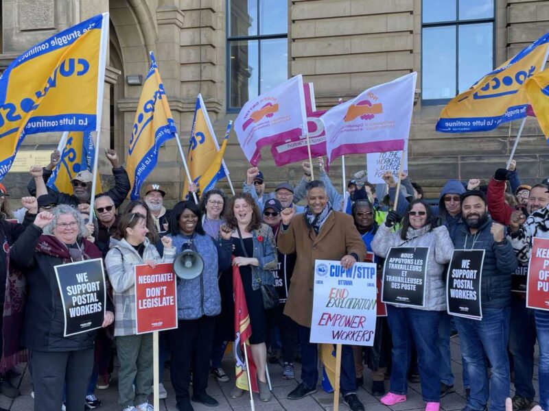 CUPW members protesting outside of the Prime Minister's office in November.