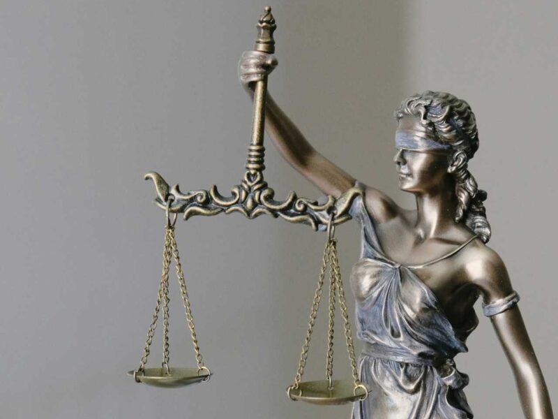 Blind lady justice holding scales.