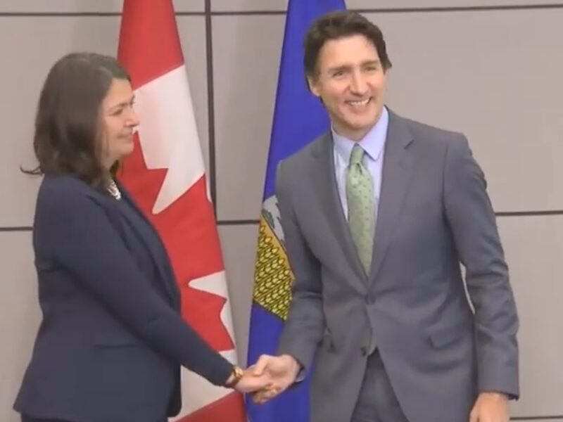 Danielle Smith and Justin Trudeau during their famously awkward handshake in 2020.