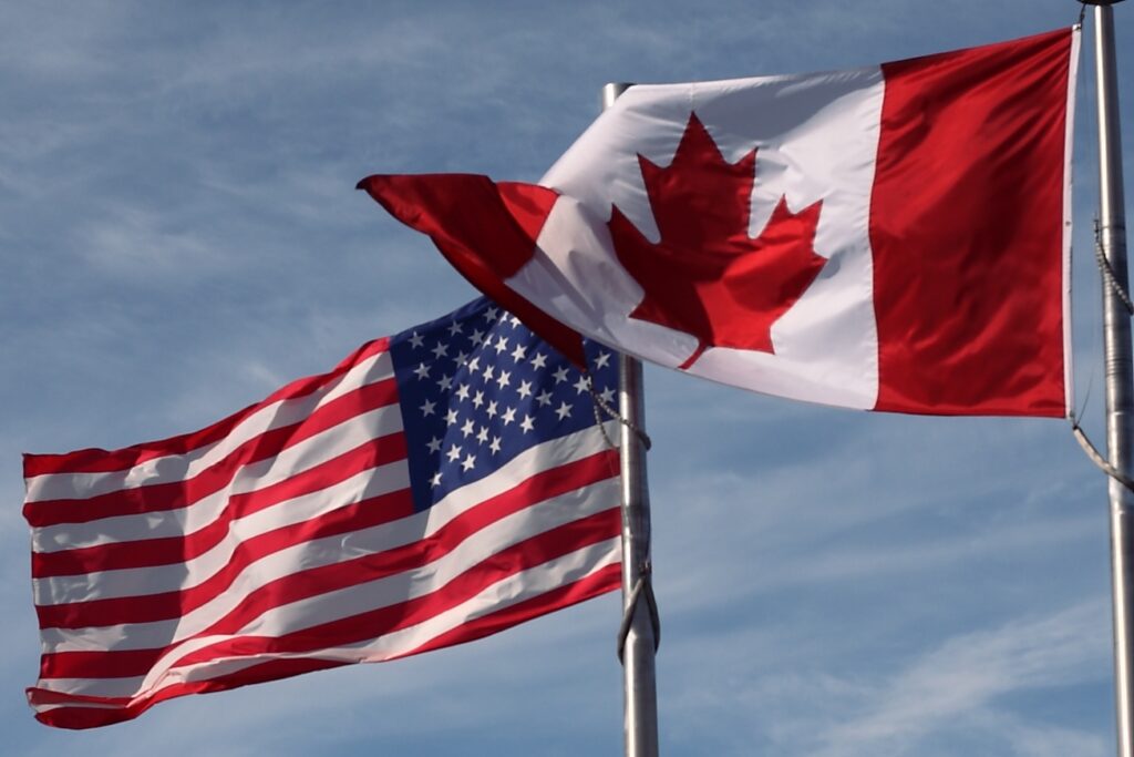 The Canadian and US flag's side-by-side.