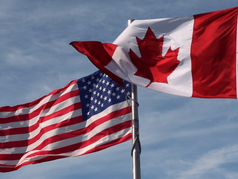 The Canadian and US flag's side-by-side.