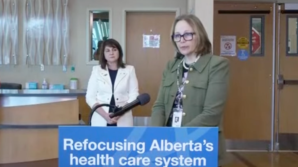 Athana Mentzelopoulos put in a rare public appearance as AHS CEO at an Alberta Government news conference last March.