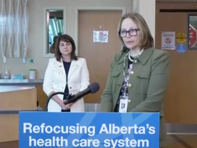 Athana Mentzelopoulos put in a rare public appearance as AHS CEO at an Alberta Government news conference last March.