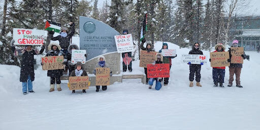 YK Citizens for Ceasefire outside of the Northwest Territories Legislative Assembly, February 23, 2024. On this day, a motion was tabled in the Assembly on behalf of the group, asking the Premier to write to the Prime Minister to demand a ceasefire.