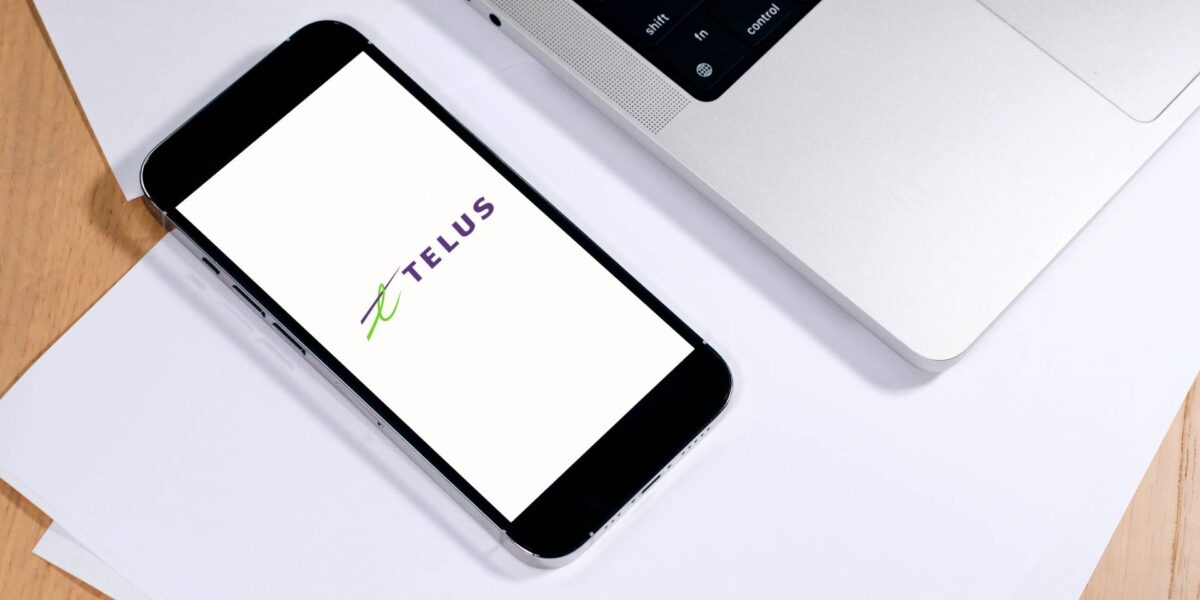 The Telus logo on a phone.