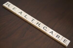 Scrabble letters spelling the word "healthcare."