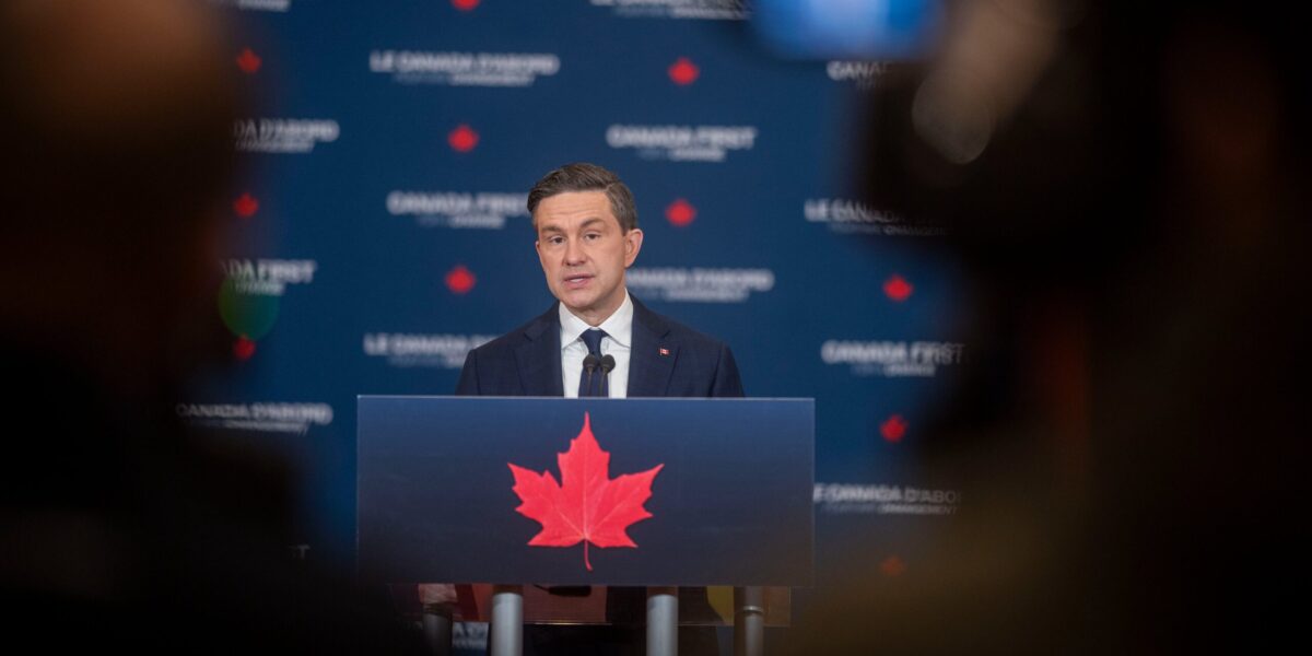 Pierre Poilievre speaking at an event.