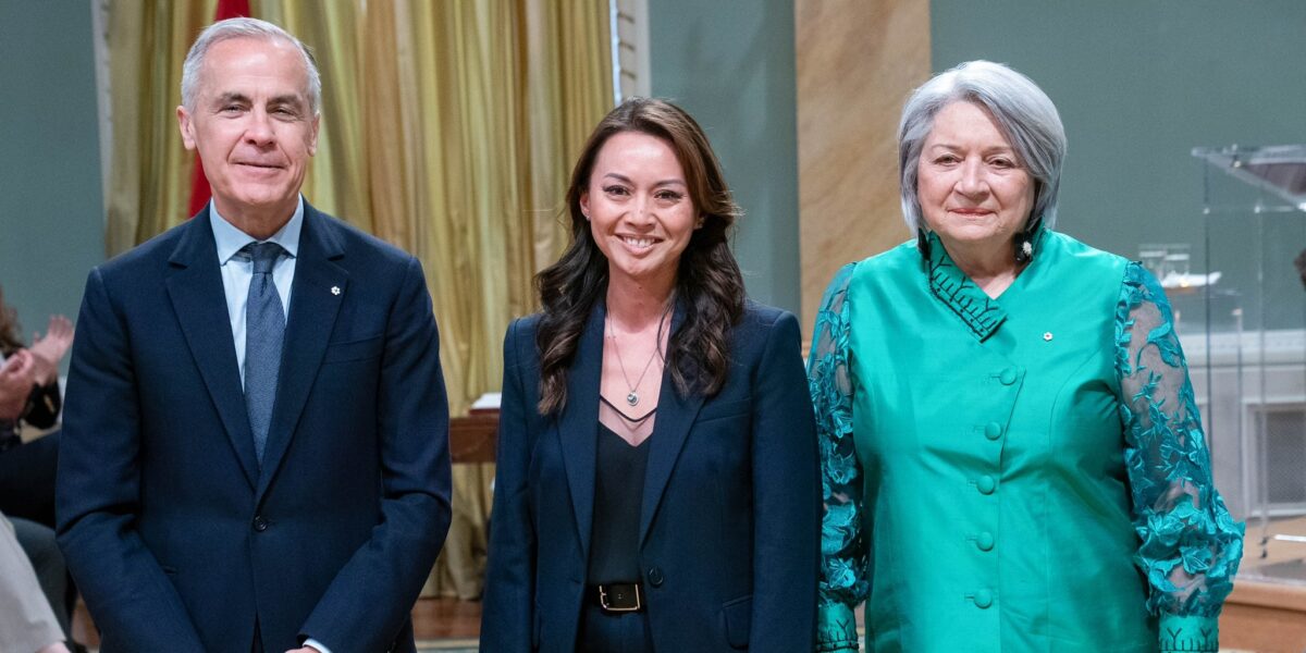 New Minister of Women and Gender Equality Rechie Valdez flanked by Prime Minister Mark Carney and Governor-General Mary Simon.