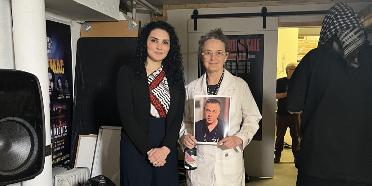 Palestinian activist Arwa Shurab with Dr. Sarah Monahan of B.C. Physicians Against Genocide. Photo being held is of Dr. Abu-Safiyeh, illegally detained in Israel.