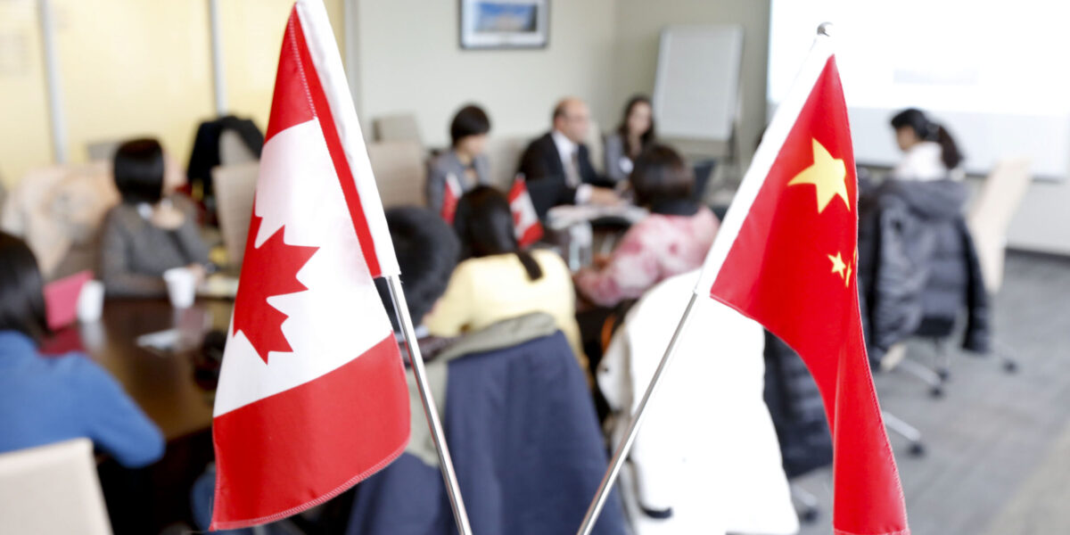 The Canada and Chinese flags.