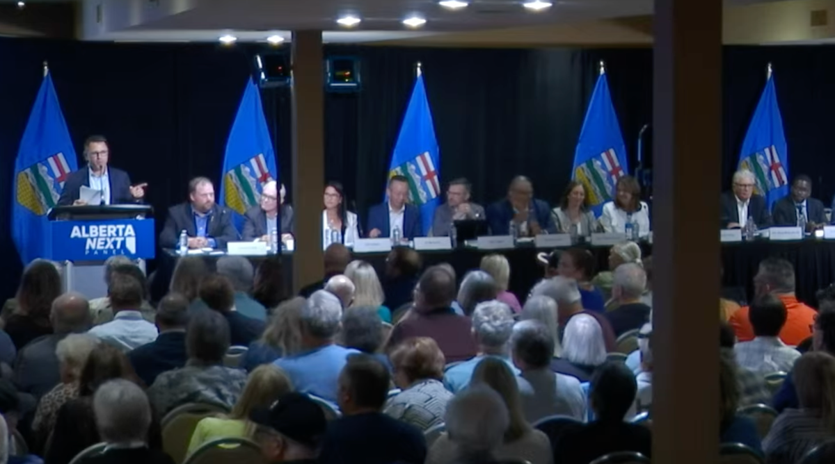 The Alberta Next Panel in the ballroom of an east-side Edmonton hotel Wednesday, July 16, moderator Bruce McAllister at the mic.