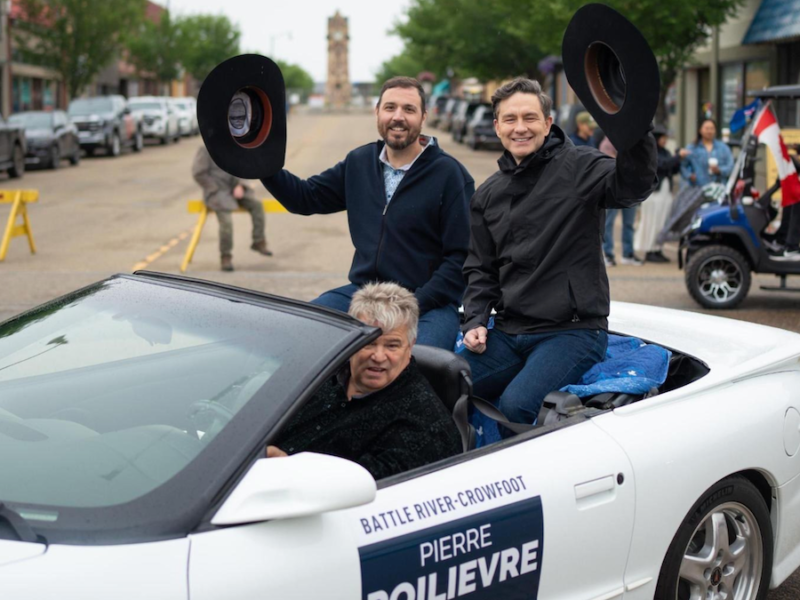 Former Battle River-Crowfoot MP Damien Kurek and his unseated federal Conservative boss, Leader Pierre Poilievre, take part in the Wainwright Stampede Parade on a damp and dreary June 21.