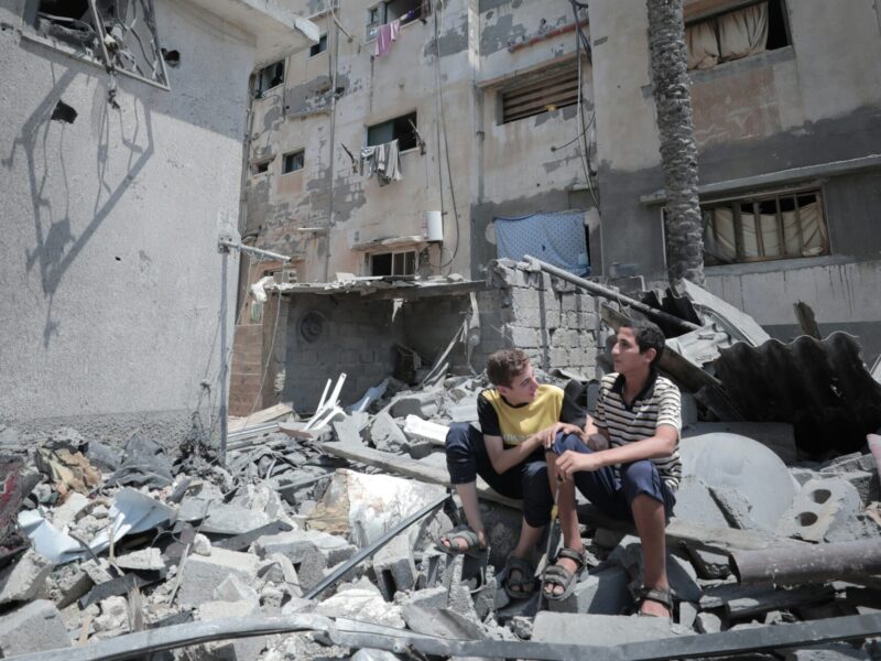 An image of two young boys amid the wrecked buildings in Gaza.