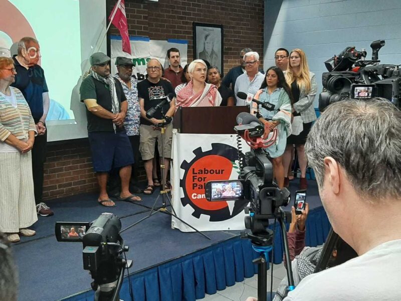 Former York Region paramedic Katherine Grzejszczak speaking at the podium at a press conference on Thursday, July 31.