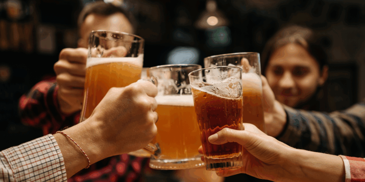 A group of people cheering with beer.