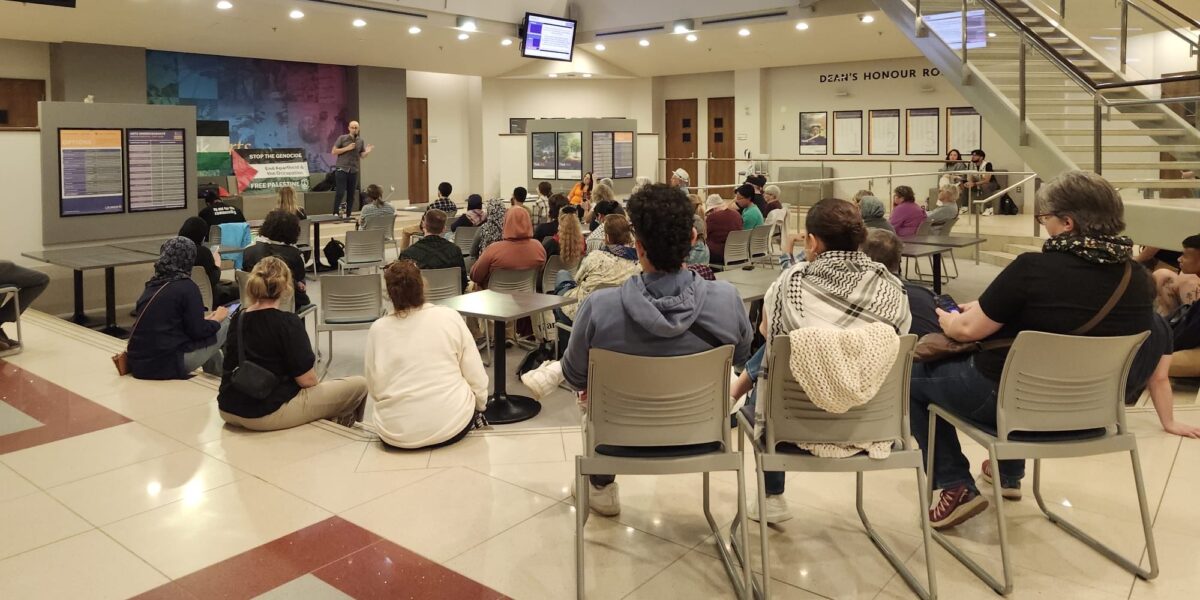 Yves Engler speaking to an audience at Wilfred Laurier University earlier this month.
