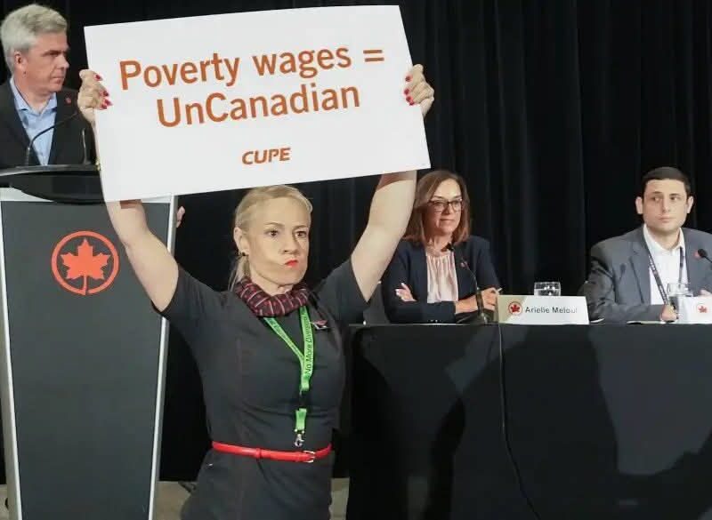 A flight attendant disrupting an Air Canada press conference on August 14.