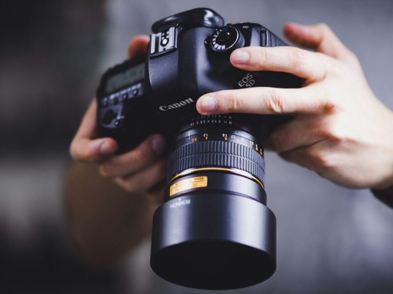 A person holding a camera.