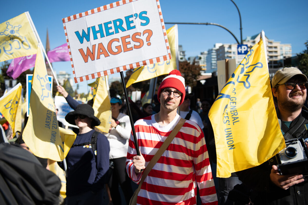 A BCGEU member dressed as Where's Waldo wondering where wages are.