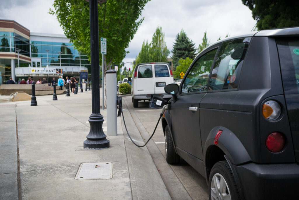 An electric vehicle at a charging station, one example of electrotech.