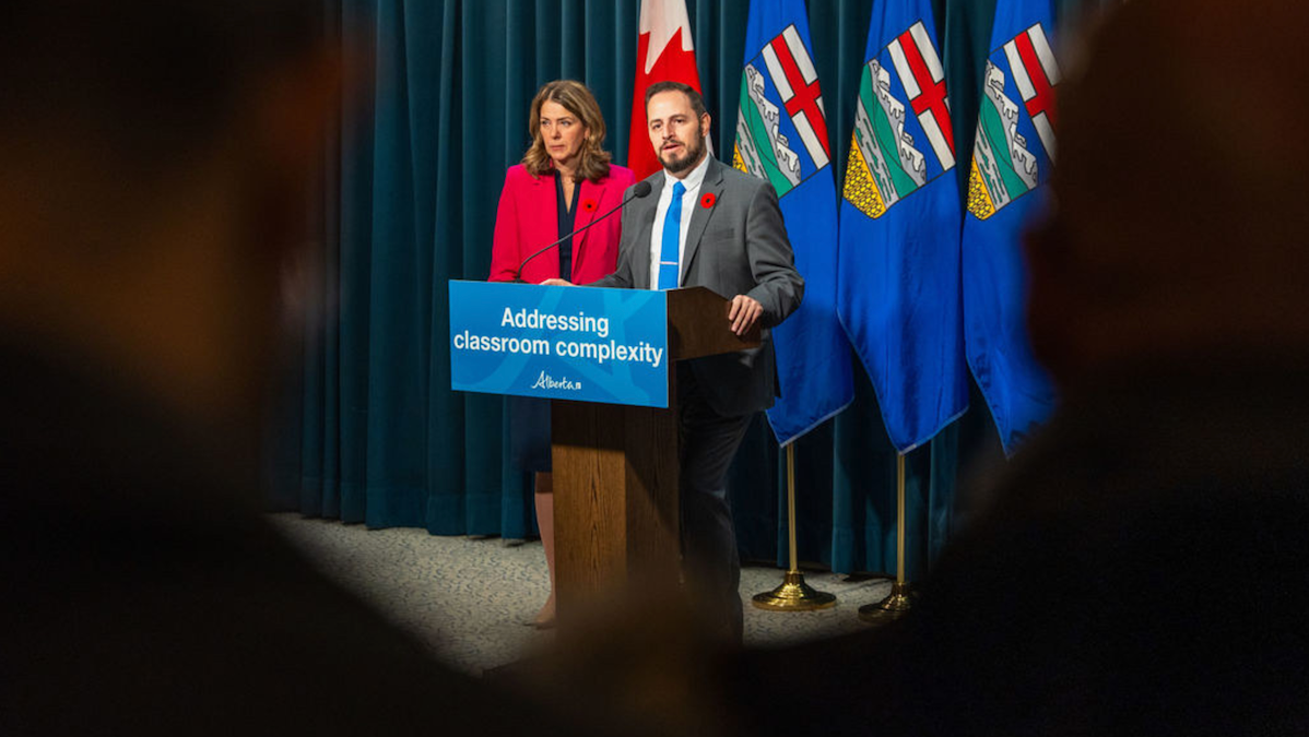 Premier Danielle Smith and Education Minister Demetrios Nicolaides at their class room complexity newser on Friday in Calgary