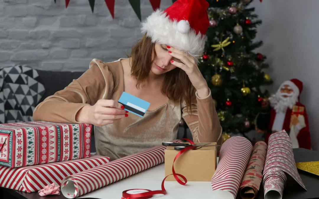 A woman stressed over the cost of the holiday season.