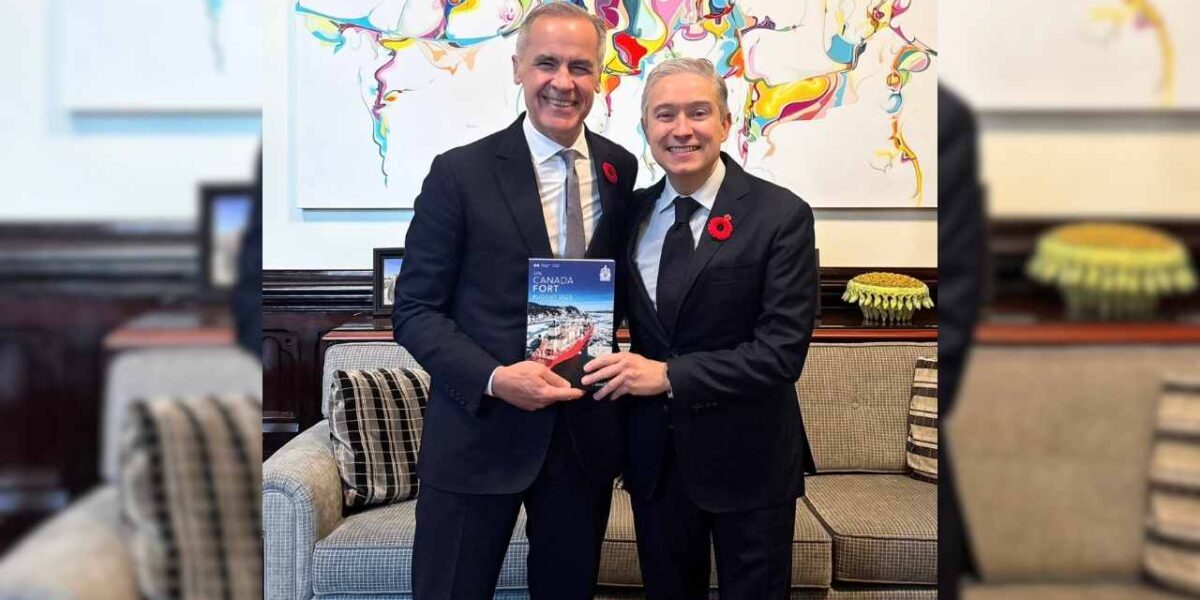 Prime Minister Mark Carney alongside finance minister François-Philippe Champagne holding the 2025 federal budget.